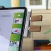 A tablet with a USB-C hub attached, displaying a YouTube interface. Produktbild-Vorschau