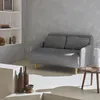 A modern living room scene with a grey corduroy sofa, wooden coffee table, and decorative items on shelves. Anteprima dell’immagine prodotto