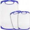Three white cutting boards with purple trim and handles are arranged in a staggered formation against a white background. Anteprima dell’immagine prodotto