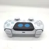A white and blue wireless game controller is shown against a white background. Produktbild-Vorschau