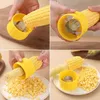 A collage of four images showing how to use a yellow corn peeler to remove kernels from a cob of corn. Produktbild-Vorschau