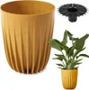 A mustard-colored planter with a ribbed design, a black drainage insert, and a small plant in a matching planter. Náhled obrázku produktu
