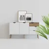 A white sideboard with wooden accents, decorated with two framed black and white photographs. Anteprima dell’immagine prodotto