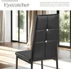 A black dining chair with decorative buttons is shown in a well-lit room with large windows and curtains. Produktbild-Vorschau