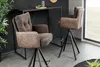 Two bar stools are placed next to a high table in a modern interior setting. Produktbild-Vorschau
