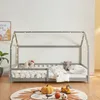 A child's house bed with bedding and stuffed animals, decorated with fairy lights. Anteprima dell’immagine prodotto