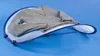 A gray sweater is laid out on a blue mesh drying rack against a blue background. Anteprima dell’immagine prodotto