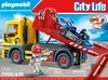 A Playmobil tow truck with a go-kart on its trailer, presented on its packaging. Produktbild-Vorschau