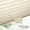 A close-up of a pleated blind with a handle, showing a textured fabric and a green, blurred background. Produktbild-Vorschau