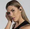 Close-up of a woman wearing black earbuds. Anteprima dell’immagine prodotto