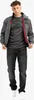 A man is standing and posing for a product shot, wearing a jacket, t-shirt, and jeans. Anteprima dell’immagine prodotto