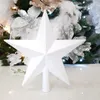A white glitter star tree topper is displayed in front of a decorated Christmas tree. Anteprima dell’immagine prodotto