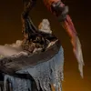 A close-up view of a dinosaur's clawed foot resting on icy terrain. Podgląd zdjęcia produktu
