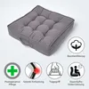 A gray square cushion is shown on a light gray and white background, with several icons and text describing its features. Náhled obrázku produktu