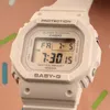 A close-up shot of a beige Casio Baby-G digital watch. Podgląd zdjęcia produktu