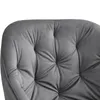 A close-up view of the tufted upholstery of a gray chair. Produktbild-Vorschau