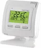 A white digital thermostat is displayed on a white stand against a white background. Voir les images du produit