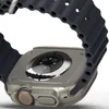 Close-up view of the back of an Apple Watch Ultra with a dark gray band. Náhled obrázku produktu