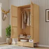An open wooden wardrobe with clothes hanging inside and items on shelves. Anteprima dell’immagine prodotto
