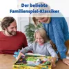 A family is gathered around a table, opening a board game. Podgląd zdjęcia produktu