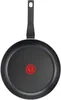 A top-down view of a black frying pan with a red logo in the center. Náhled obrázku produktu