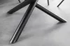 A close-up shot of the black metal legs of a round dining table. Produktbild-Vorschau