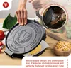A person is using a cast iron tortilla press to make a tortilla. There are also ingredients like corn and tomatoes visible. Náhľad obrázku produktu