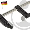 A close-up shot of a clamp on a white background. Produktbild-Vorschau
