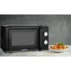 A black MEDION microwave is shown on a wooden surface with a bowl of food next to it. Anteprima dell’immagine prodotto