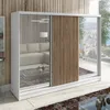 A modern wardrobe with mirrored doors and wooden slats, reflecting a living room interior and a city view from a balcony. Produktbild-Vorschau