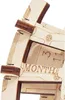 A close-up view of a wooden perpetual calendar puzzle, showing some of the assembled pieces and printed text. Anteprima dell’immagine prodotto