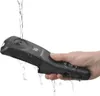 A hand holding a black kitchen gadget under running water. Produktbild-Vorschau