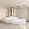 A modern reception desk in a clean, minimalist interior. Produktbild-Vorschau
