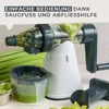 A manual juicer processing celery, with chopped celery and juice visible. Produktbild-Vorschau