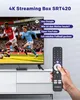 A hand holding a remote control in front of a TV displaying a soccer match, with marketing text and voice commands overlaid. Voir les images du produit