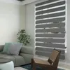 A living room scene with a sofa, chair, and window blinds. Voir les images du produit