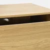 Close-up view of a wooden drawer with a white push-to-open mechanism visible inside. Anteprima dell’immagine prodotto