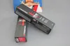 Two boxes of Goldwell Topchic hair color are displayed on a gray surface, with a blurred image of a person in the background. Náhled obrázku produktu