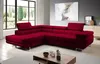 A modern living room with a large red sectional sofa, a coffee table, and artwork on the wall. Produktbild-Vorschau