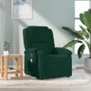 A dark green massage chair is shown in a living room setting, next to a small wooden side table and a large potted plant. Náhľad obrázku produktu