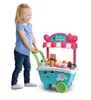 A young girl is playing with a VTech Scoop & Learn Eiswagen (ice cream cart) toy. Anteprima dell’immagine prodotto