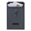 A dark gray mailbox with a key and letters inside. Podgląd zdjęcia produktu