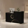 A modern black reception desk with integrated lighting and a computer. Produktbild-Vorschau