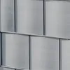 A close-up view of a fence made of grey, textured panels. Produktbild-Vorschau