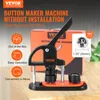 A button maker machine is displayed on a wooden surface, with a box and promotional graphics in the background. Produktbild-Vorschau