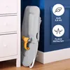 A folded baby bouncer is leaning against a blue wall next to a white dresser. Produktbild-Vorschau