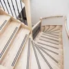 A view looking down a wooden staircase with black anti-slip strips on the treads. Produktbild-Vorschau