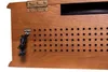 A close-up view of the back of a wooden stereo system, showing an antenna input and ventilation holes. Produktbild-Vorschau