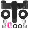 A black bathroom faucet with accessories laid out on a white background. Produktbild-Vorschau