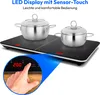 A black double induction cooktop with two silver pots on top, with a close-up inset showing a finger touching the control panel. Produktbild-Vorschau